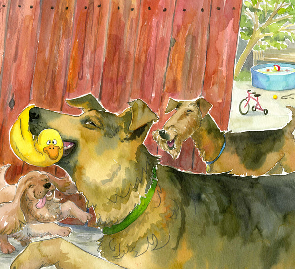 A German Shepherd dog holds a yellow squeaky duck in its mouth in front of a red wood fence, with two other happy dogs looking on. Backyard with toys in the background.