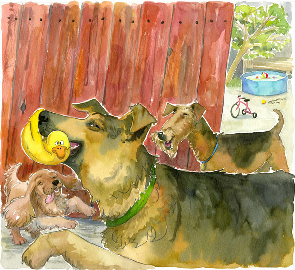 A German Shepherd dog holds a yellow squeaky duck in its mouth in front of a red wood fence, with two other happy dogs looking on. Backyard with toys in the background.